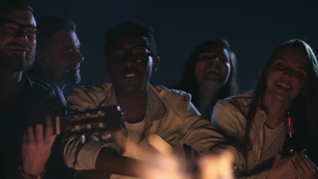 Young People Singing by Campfire