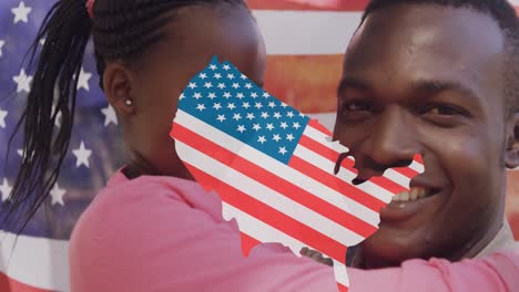 Animation-of-usa-map-in-colours-on-usa-flag-over-happy-african-american-father-and-daughter