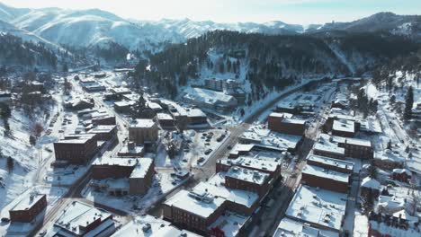 Drone-orbiting-over-Deadwood,-South-Dakota-in-winter