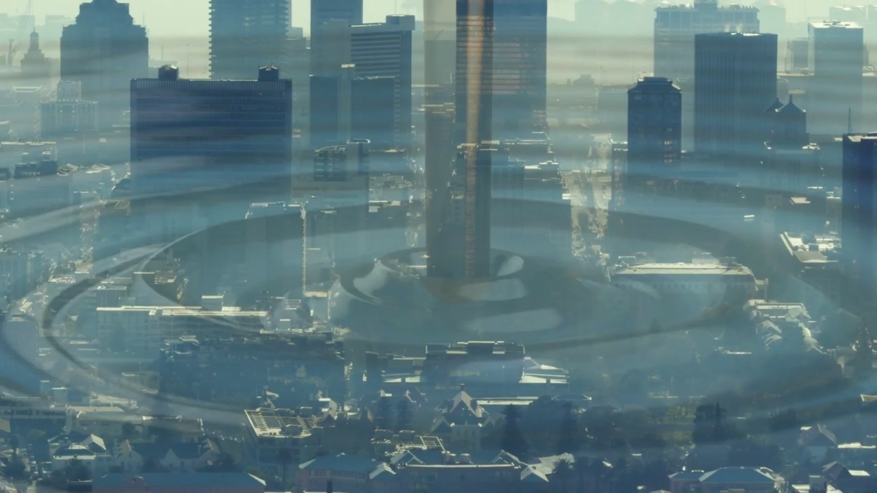 Central tower sending expanding ripple rings after faint distortion, signaling across hazy skyline