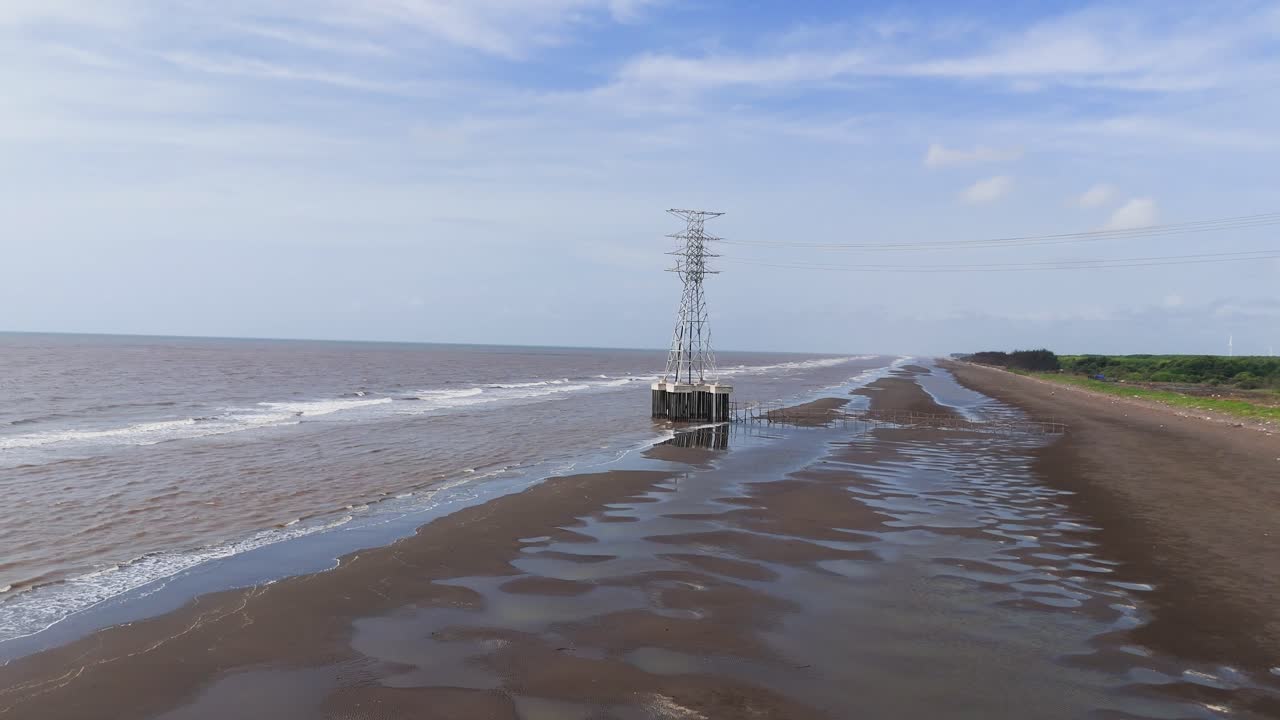 Aerial View Pan of the Wind Farms at the Sea in Ben Tre.