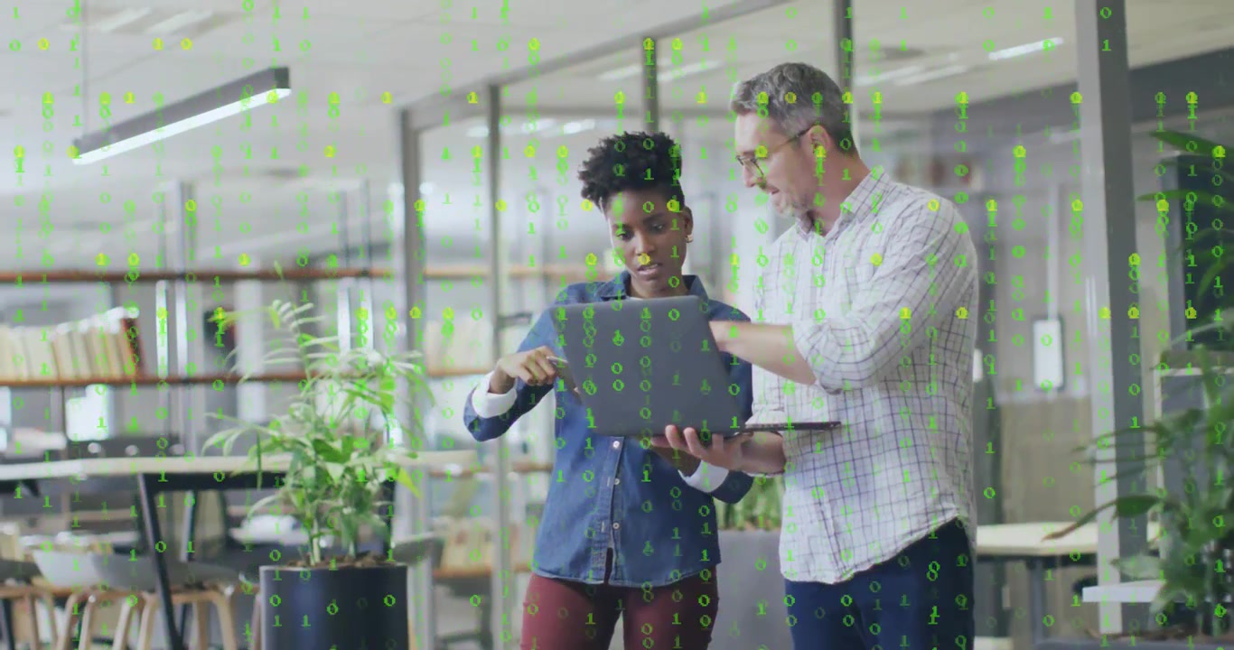 Developer presenting laptop to coworker, binary overlay streaming, tapping card for encryption demo