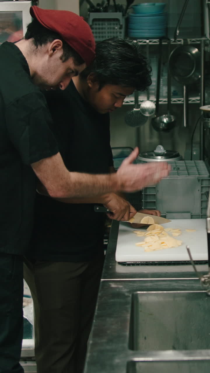 Man cutting food in kitchen