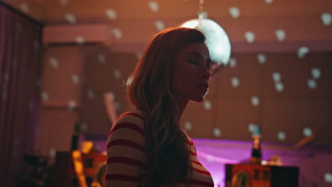 lonely woman dancing lights disco ball feeling sadness close up. unhappy lady
