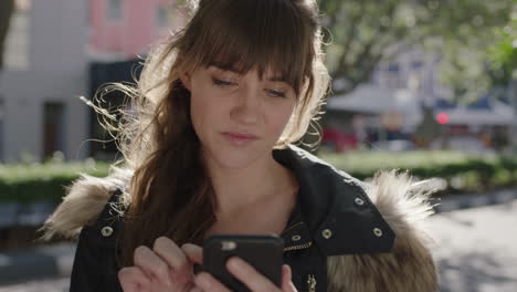 portrait of beautiful cute young woman smiling happy using smartphone texting browsing social media enjoying mobile technology