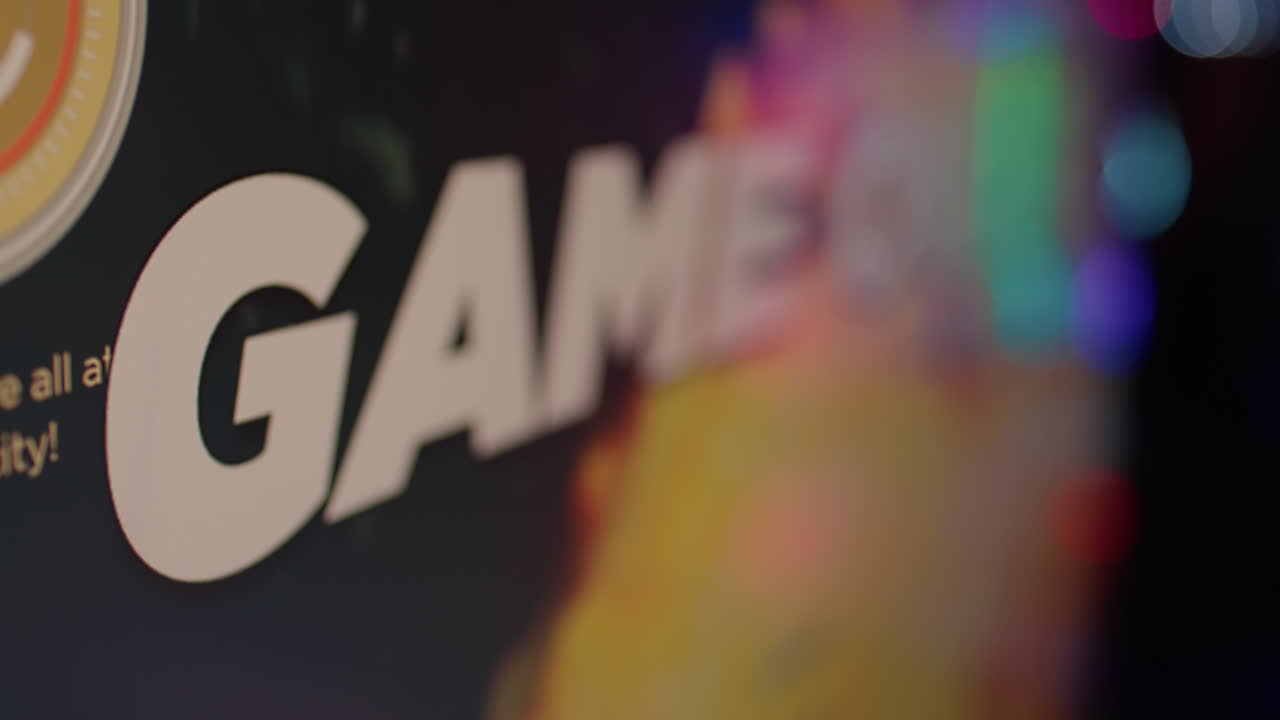 Extreme closeup on game over text on computer screen after failing level in online space shooter