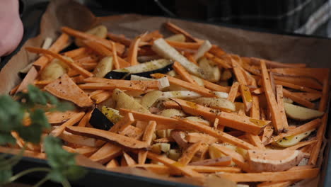 Slow-Motion-Footage-Of-A-Chef-taking-baking-sheet-with-Vegetables-cooking-a-healthy-meal