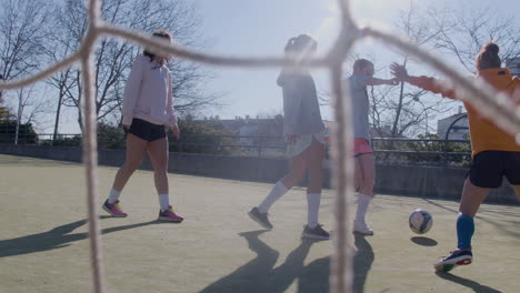 Sporty-Teenager-Girls-Playing-Soccer-At-Open-Air-Pitch