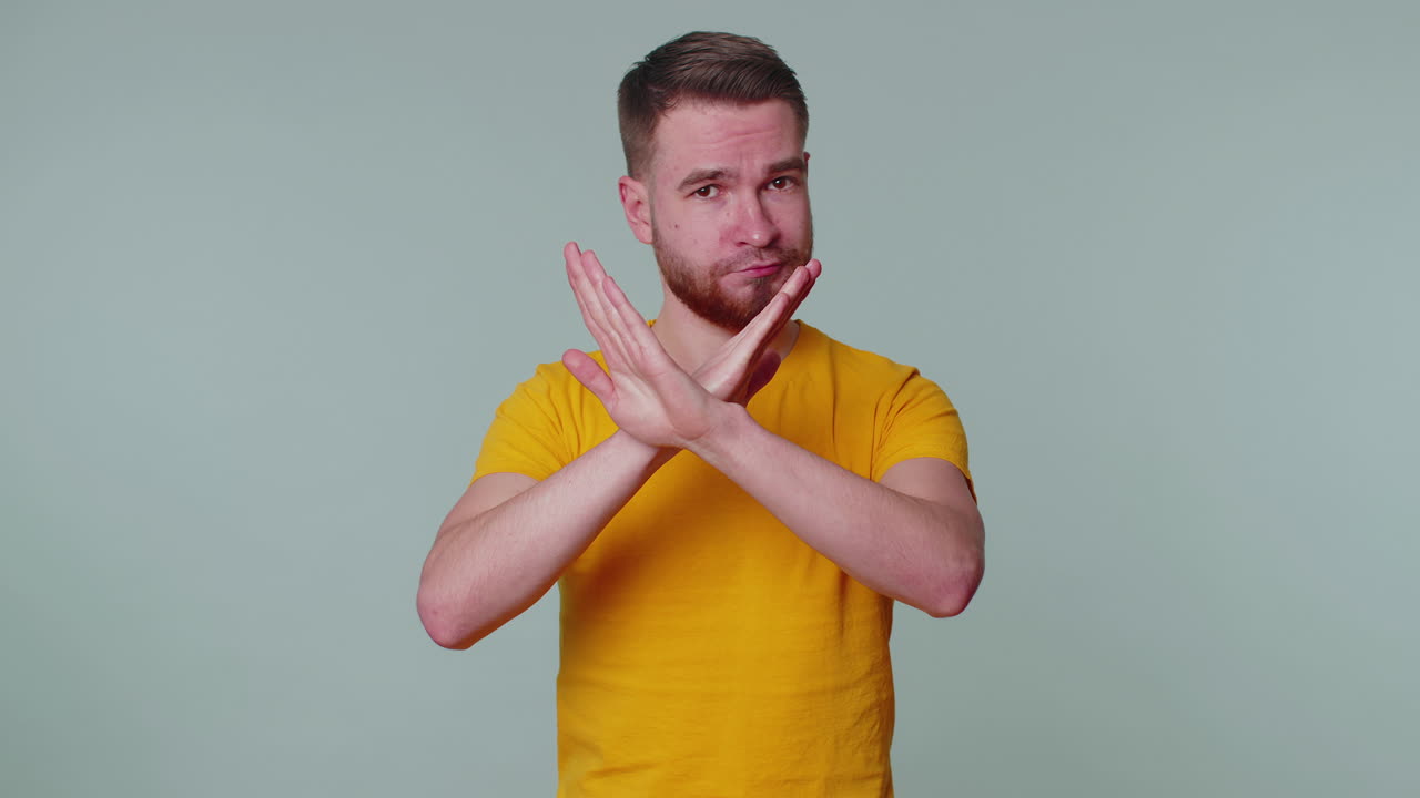 Frightened scared man closing his mouth gestures no, refusing to tell terrible secret, truth