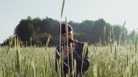 photographer in a wheat field