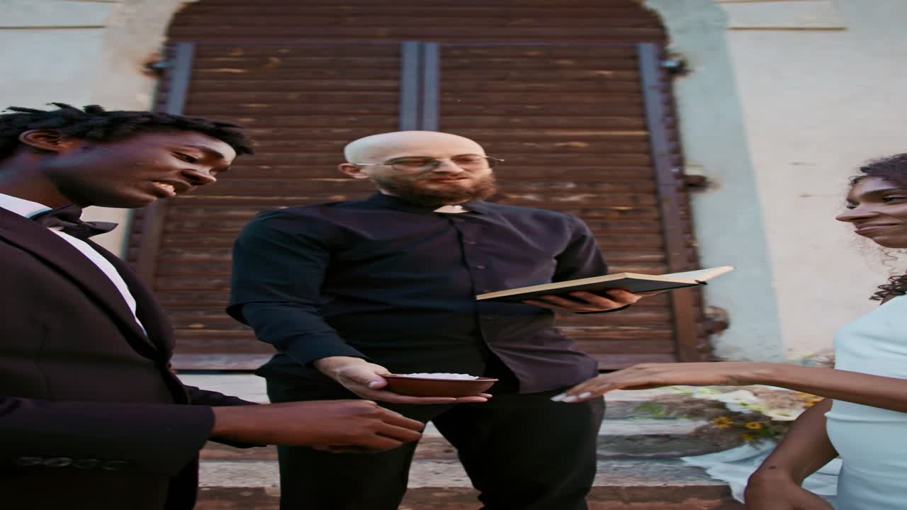 Wedding Ceremony with Priest, Groom, and Bride