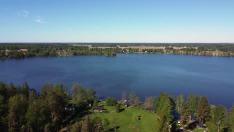 low flyover of idyllic lakeside homes on lake tuusula in rural finland