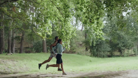 active people jogging outdoors in a green forest