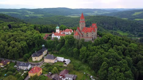 bouzov castle and village in lush green landscape