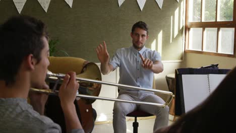 teenage musicians rehearsing