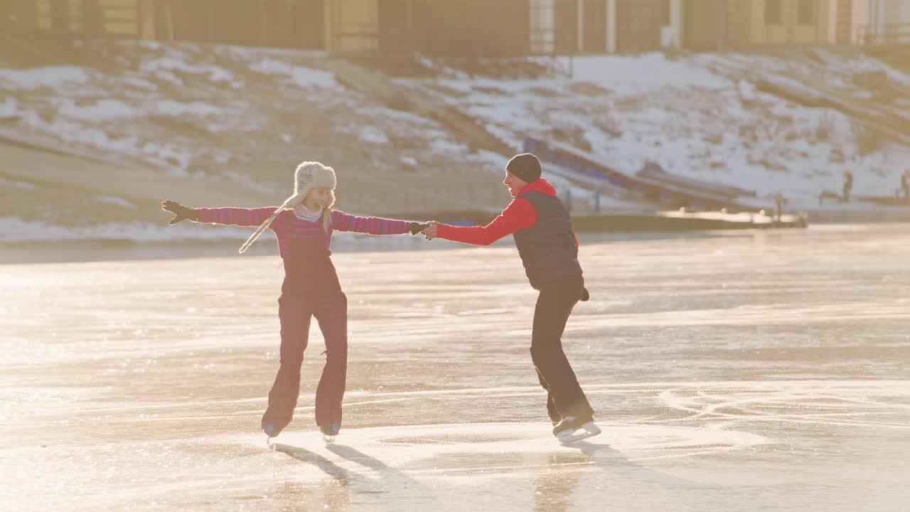 Couple Ice Skating on a Frozen Lake