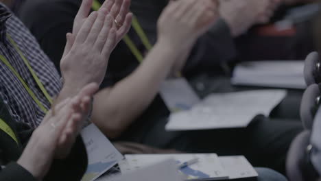 hands clapping at a corporate event