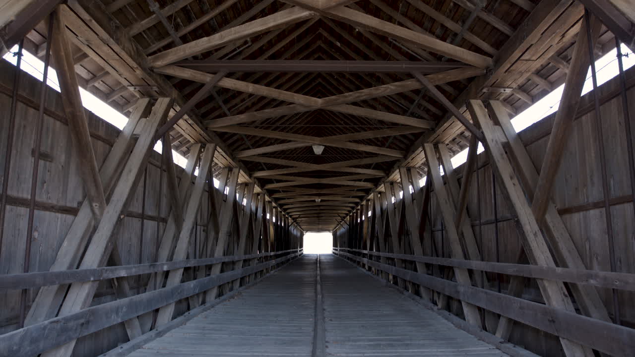 Interior of Old Wooden Covered Bridge Panning Down from Ceiling in Center