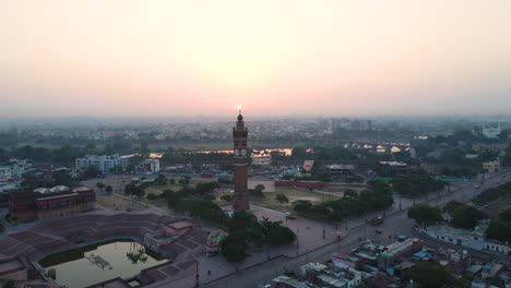 aerial view of lucknow's clock tower as the city wakes up, with sunrise casting a peaceful atmosphere.