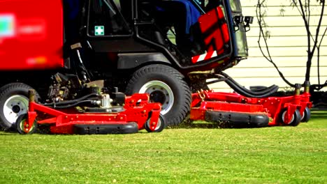 close up slow motion of commercial lawn mower in the yard