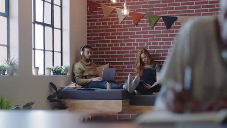 young diverse business students studying friends using smartphone taking photo together sharing friendship on social media in relaxed modern office workplace