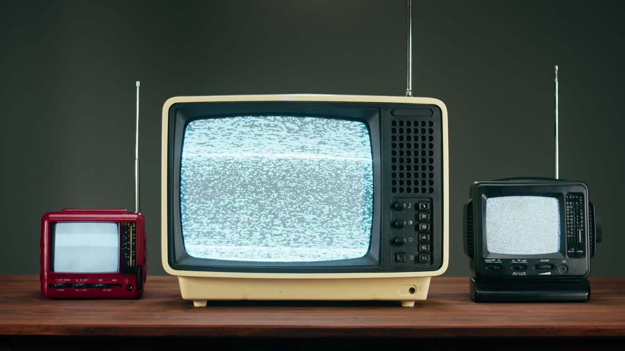 Three Retro Televisions with Static