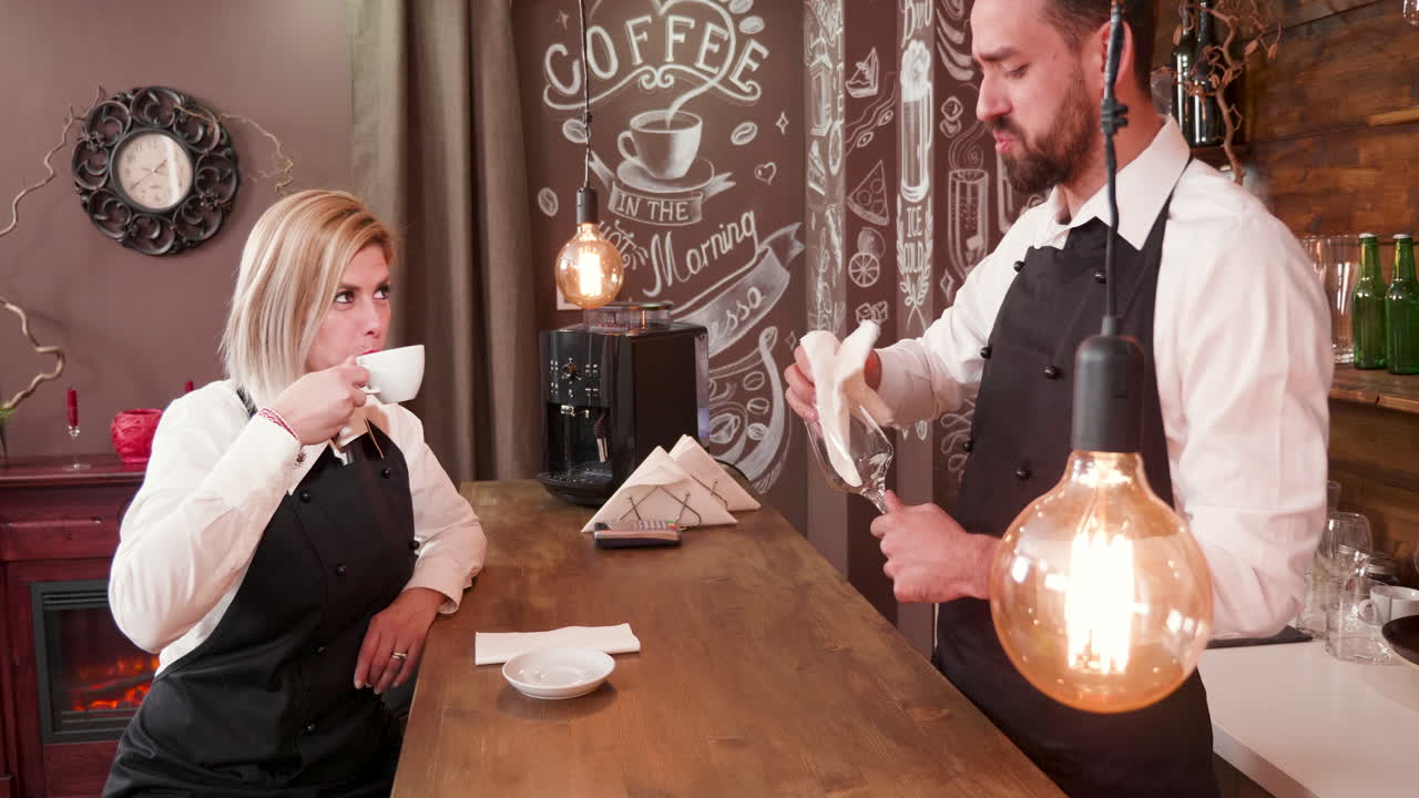 Barista Serving Coffee to a Customer in a Cafe