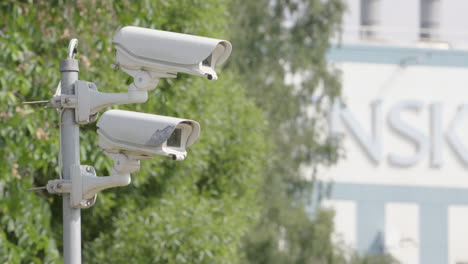 cctv cameras mounted on pole for security surveillance, rack focus