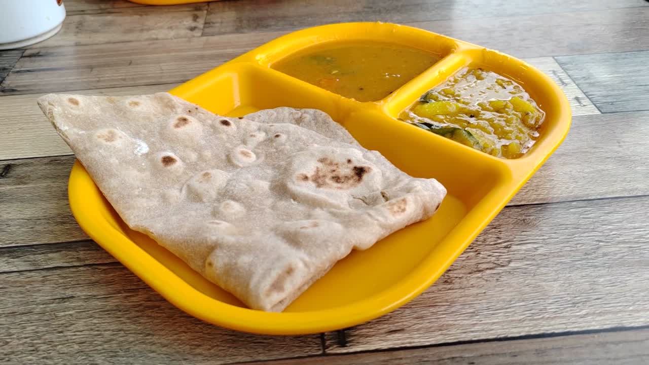 Capati, served with two delicious gravies, makes for a perfect breakfast. This traditional flatbread offers a satisfying and flavorful start to your day.