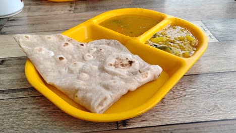 capati, served with two delicious gravies, makes for a perfect breakfast. this traditional flatbread offers a satisfying and flavorful start to your day.