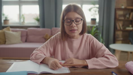 girl doing homework at home