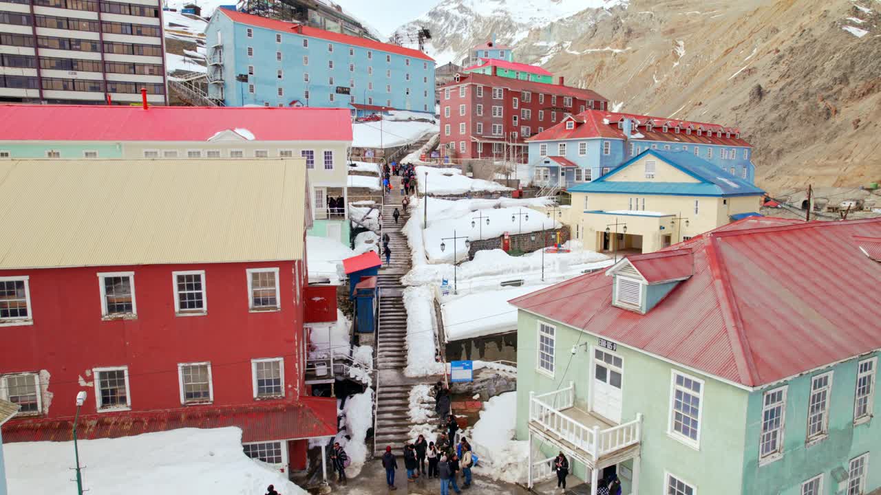 Panoramic view ascending between the buildings of Sewell, city of stairs, mining camp and UNESCO World Heritage Site, Andes Mountains, Chile.