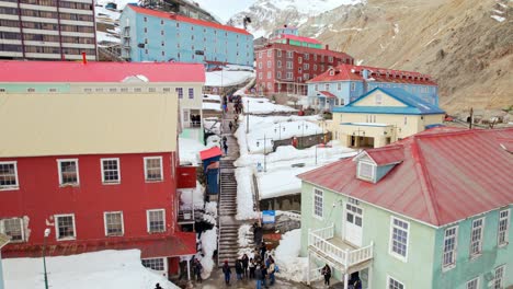 panoramic view ascending between the buildings of sewell, city of stairs, mining camp and unesco world heritage site, andes mountains, chile.