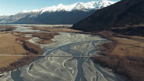 drone tilt reveal of glacier fed rivers in new zealand countryside