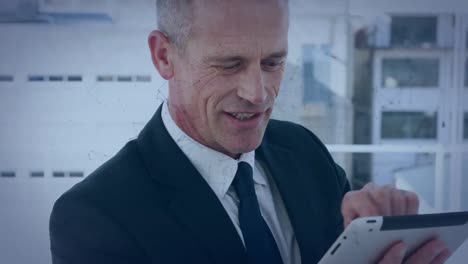 network of connections over caucasian senior businessman using digital tablet at office