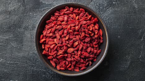 Top-View-of-Goji-Berries-in-a-Bowl-on-Dark-Background