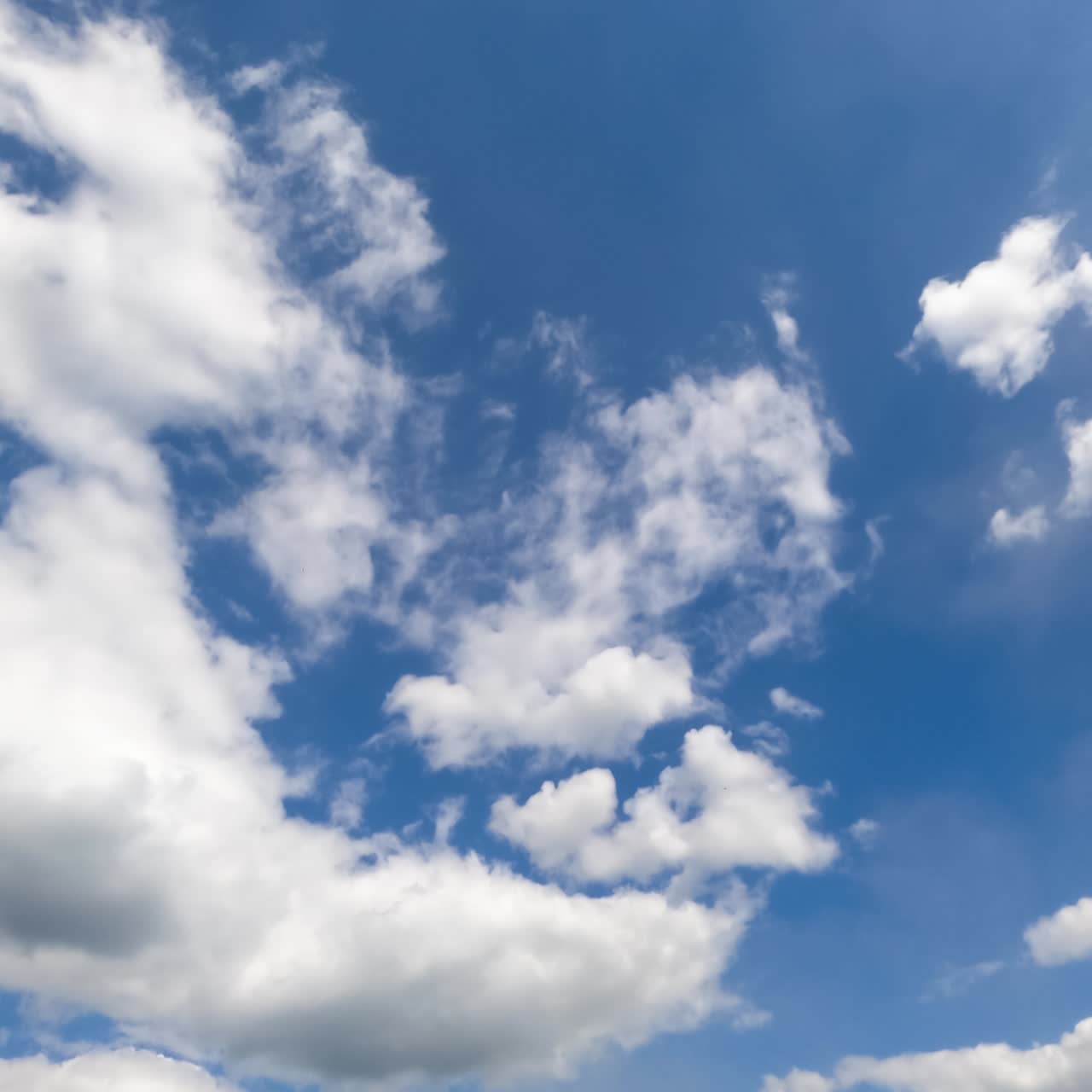 Transformation of beautiful white puffy clouds. Timelapse of amazing cloudscape moving in the sky