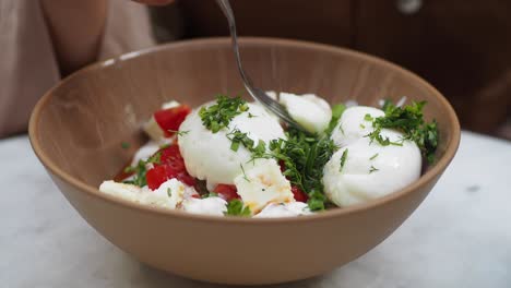 poached eggs with tomatoes, feta, and parsley