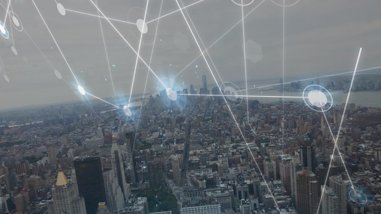 Animation of glowing network of connections against aerial view of cityscape