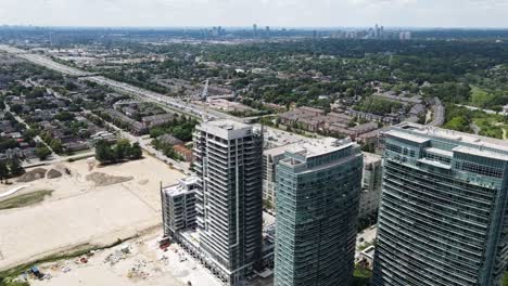 aerial view of apartment buildings next to a construction site in etobicoke