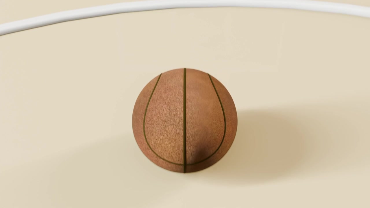 Inquadratura dal basso di un pallone da basket ruvido che scende attraverso il canestro in una palestra, segnando un punto