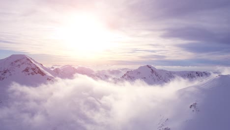 snowy mountain peaks at sunrise/sunset