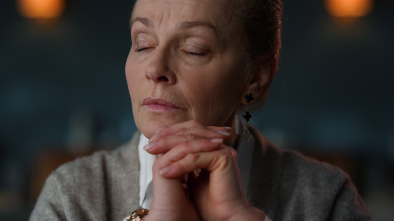 Senior business woman thinking with hands crossed