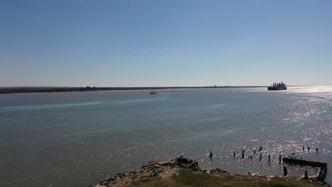 shrimp boat and merchant ship in san jacinto river