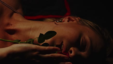 intimate portrait of a woman with a rose