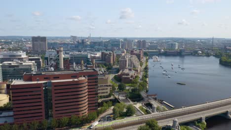 drone flying away from downtown boston with skyline in background on beautiful day