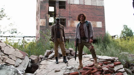 men guarding an abandoned building