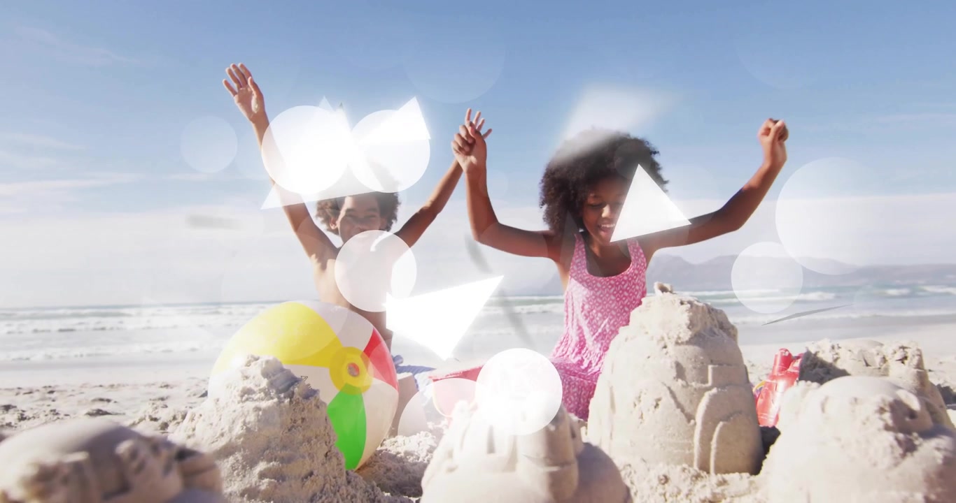 Siblings building sandcastle towers on beach, showcasing animated education icons and infographics