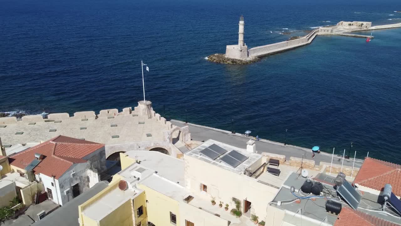 Aerial view of iconic lighthouse in old Venetian harbor of Chania, Crete, Mediterranean sea