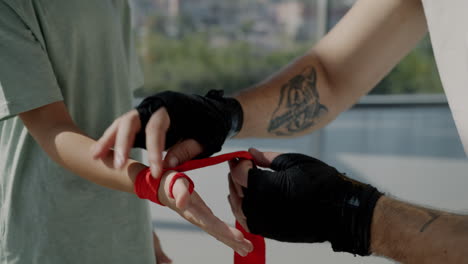 child learning boxing with a trainer